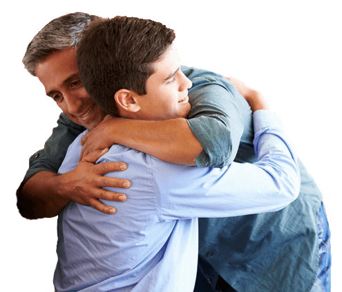 Man supporting teen with hug